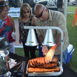 Volunteer Joe Arruda carves the prime rib